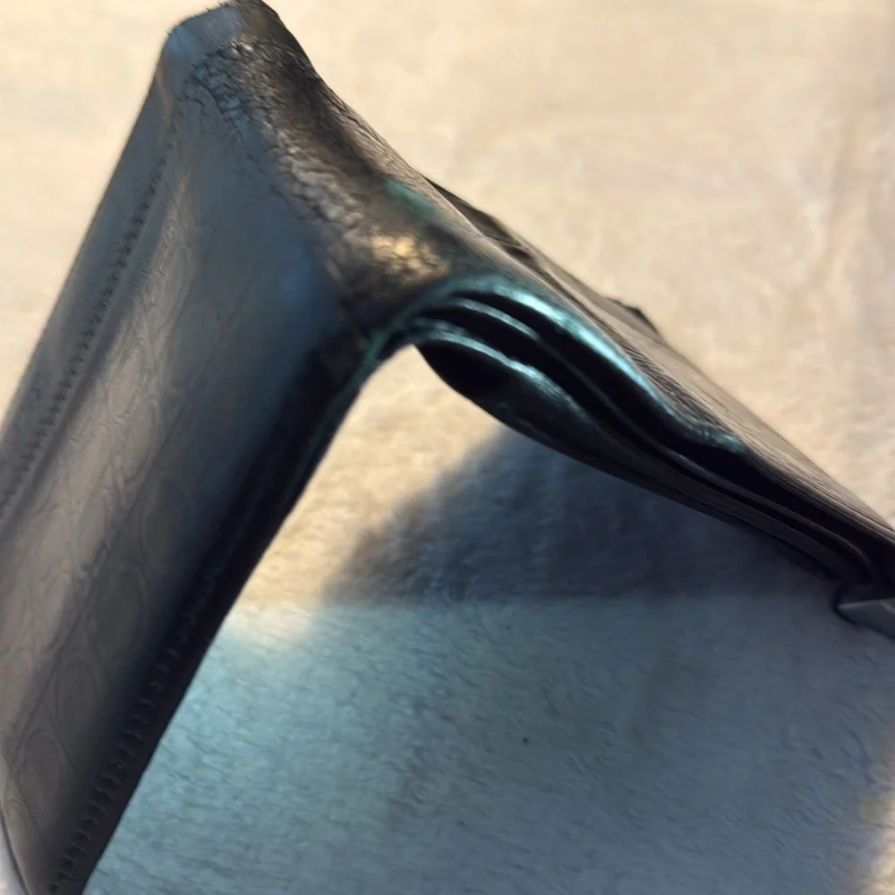 Salvador Ferragamo black bifold wallet.